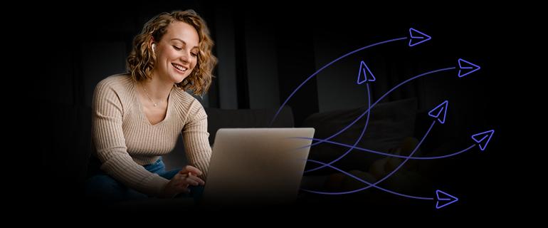 A woman sending an email campaign from her laptop