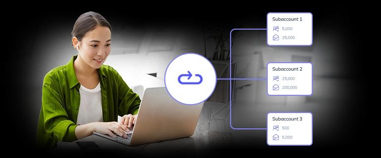 A woman working at a laptop, setting up Subaccounts in Elastic Email app