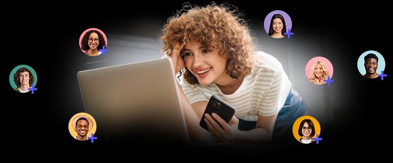 A woman looking at her laptop with amazement, as her contact list grows.